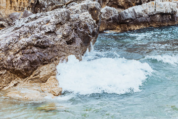 Wall Mural - view of rocky sea beach in storm weather