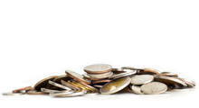Pile Of Coins On White Background. Selective Focus. Saving Coins Money Concept