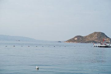 Alone island. Scenic landscape with mountain islands and blue lagoon on Aegean sea. Exotic scenery. Popular landmark, famous destination of Bodrum, Turkey.