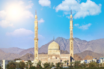 Beautiful architecture of Mosque in Sharm el sheikh, Egypt. Sinai mountains background. Blue clouds sky at sunny day