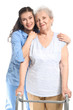 © Pixel-Shot - Young caregiver with senior woman on white background