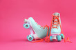 Vintage roller skates on color background