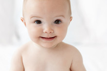 Close Up Portrait Of Smiling Baby