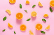 Sliced citrus fruits and mint leaves on color background