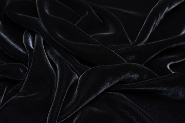 Silk fabric with viscose, velvet. Black colour. Texture, background, pattern.