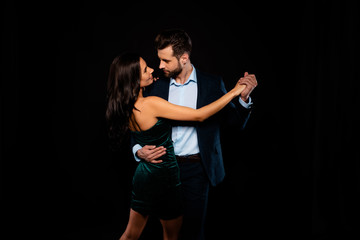 Canvas Print - Close up back rear behind photo beautiful she her wife spine he him his husband mrs mr married spouse hold hands tango slow dance position wear costume jacket green dress isolated black background