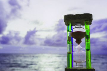 Wall Mural - Hourglass, sky background with the sea in Phuket, Thailand.