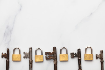 Poster - Vintage keys and padlocks overhead lay flat composition. Security concept