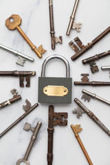 Poster - Vintage keys and padlock overhead lay flat composition. Security concept