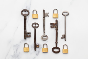 Poster - Vintage keys and padlocks overhead lay flat composition. Security concept