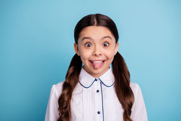 Poster - Close up photo of sweet child make face grimace wear white blouse isolated over blue background