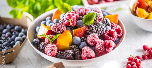 Cuadros en Lienzo Frozen fruits blueberries blackberry raspberry red currant peach and herbs melis
