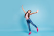 © deagreez - Full length body size view charming cute child have free time holidays laugh laughter feel content rejoice stylish trendy dressed fashionable jeans t-shirt fuchsia sneakers isolated blue background