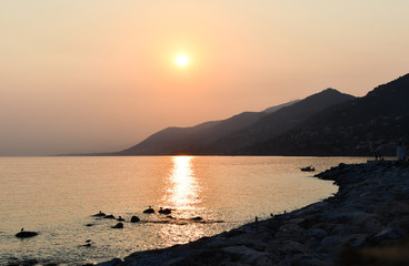 Wall Mural - Panorama on the mediterranean coast of Liguria during the sunset