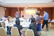 © Koonsiri - blurry image. speaker or lecturer with startup business team brainstorming on meeting workshop. team working on project together and sharing ideas in workshop.