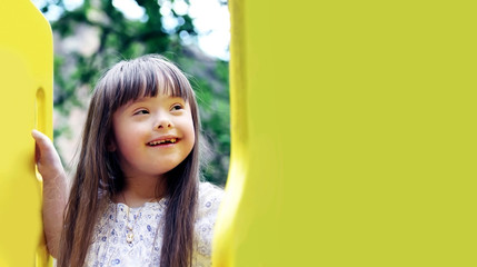 Wall Mural - Portrait of beautiful young girl on the playground.