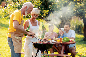 Poster - Senior couple make barbecue