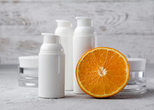 Set Of Cosmetic Bottle Containers With Orange. Blank Label For Branding Mock-up.