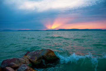 Canvas Print - Beautiful sunset over the stormy lake Balaton in Hungary