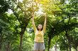 © gballgiggs - Asian woman enjoying and freedom with open hands,Female rise hands up enjoy nature outdoor