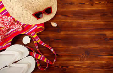 Vacation travel equipment Straw hat, sunglasses And marine objects, shells, on wooden floor - Image