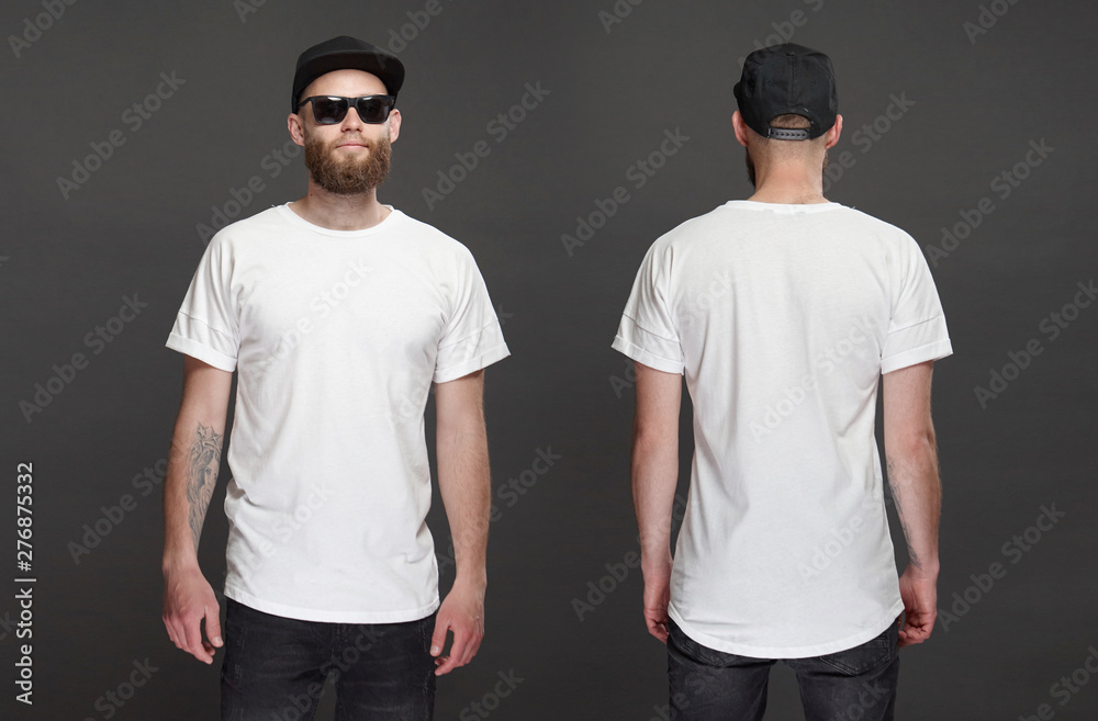 Hipster handsome male model with beard wearing white blank t-shirt and a baseball cap with space for your logo or design in casual urban style. Front and back view - obrazy, fototapety, plakaty 