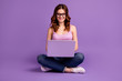 Portrait of charming lovely nice lady have device social networking feel positive information wear stylish trendy style hipster outfit isolated purple violet background