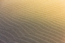 The Abstract Wave Line Textures On A Pacific Beach Illuminated By The Sun And An Empty Quarter