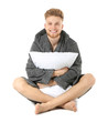 © Pixel-Shot - Handsome man with pillow on white background