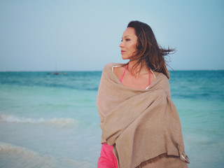 Beautiful woman relaxing near the ocean