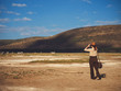 © Nejron Photo - Beautiful woman with binoculars at savanna in Kenya
