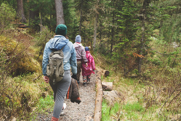 mother with sons hiking in the north woods