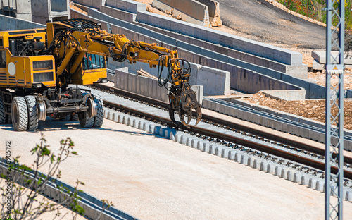 Cuadros en Lienzo Close up rail excavator on reconstruction of the railway rails