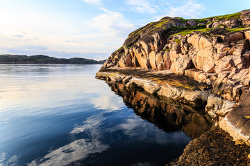 Poster - Northern polar summer. Beautiful coastline of Barents sea, rocks reflecting in the calm water surface. Arctic ocean, Kola Peninsula, Russia