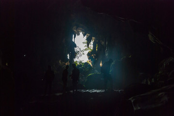 Wall Mural - Exploring caves near Vang Vieng