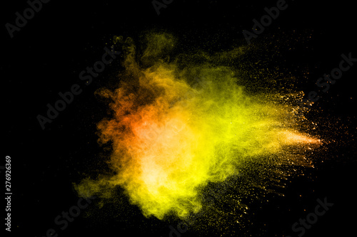 The explosion of colorful pigment powder on black background. Vibrant color d...