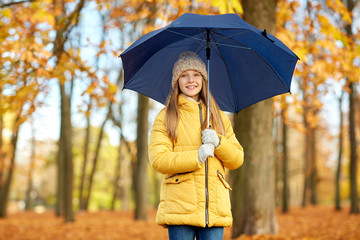 Poster - season and weather concept - happy girl with umbrella at autumn park