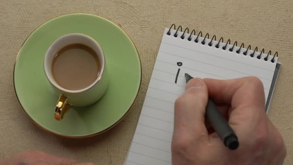 Canvas Print - ikigai, a reason for being, japanese concept - man hand writing a note with a black marker in a spir
