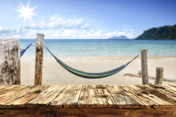 Desk of free space and summer beach background 