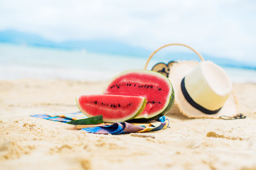 Summer picnic time on a beach. Fresh water melon