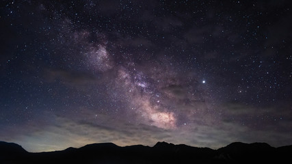 Wall Mural - Milky Way over the mountain peaks