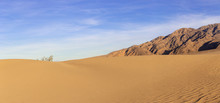 Sand Dunes In A Desert Landscape In Death Valley California.  The Vast Barren Land Is Dry And Arid Due To Droughts Result Of Global Warming And Climate Change.