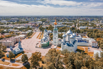 Scenic aerial view of old kremlin in ancient touristic town Vologda in Russian Federation. Beautiful summer sunny look of orthodox temple in fortress in urban area of capital of russian province