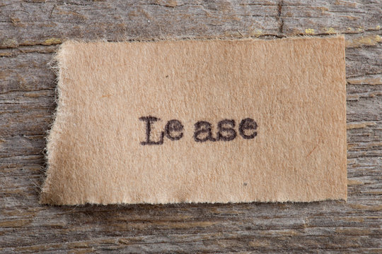 Lease typed text on a paper, real estate concept