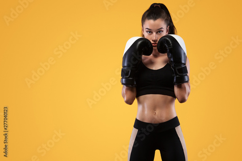 Fotografía Sportsman, woman boxer fighting in gloves