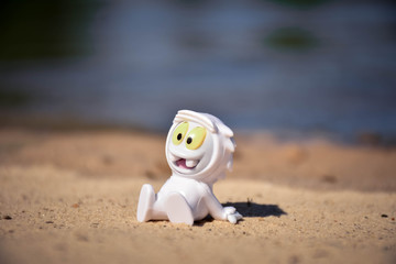 doll in the sand