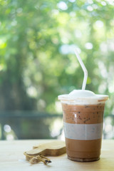 Iced mocha coffee on wooden table