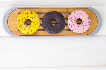 Canvas Print - Sweet tasty donuts with colorful icing.