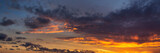 Fototapeta Niebo - Dramatic Panoramic View of a cloudscape during a dark and colorful sunset. Taken over Beach Ancon in Trinidad, Cuba.