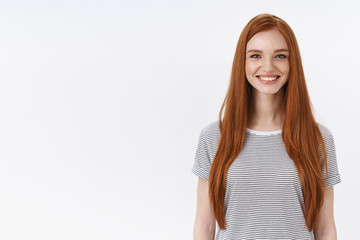 Wall Mural - Charming friendly pleasant redhead girl university student smiling happily camera look energized participate dance class learning new hobby standing white background entertained, lifestyle concept